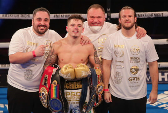 Lee McGregor celebrates with his team including trainer Ben Davison after winning the European Bantamweight title on Friday Photo Credit: Scott Rawsthorne/MTK Global