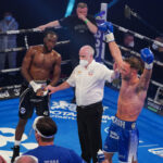 Cash celebrates after adding another belt to his collection Photo Credit: Round ‘N’ Bout Media/Queensberry Promotions