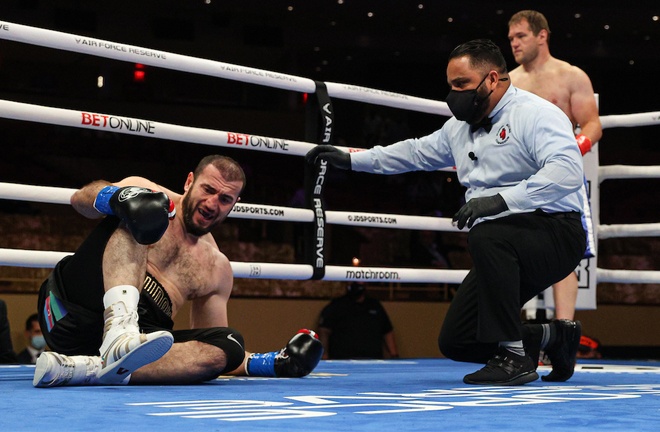 Majidov appeared to be in some discomfort holding his ankle after dropping to the canvas Photo Credit: Ed Mulholland/Matchroom