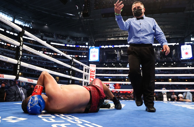 Aguilera winced in pain on the canvas and complained that he had been hit to the back of the head Photo Credit: Ed Mulholland/Matchroom