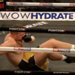Tomas Salek hitting the canvas the first time around following a flurry of uppercuts from Ali.