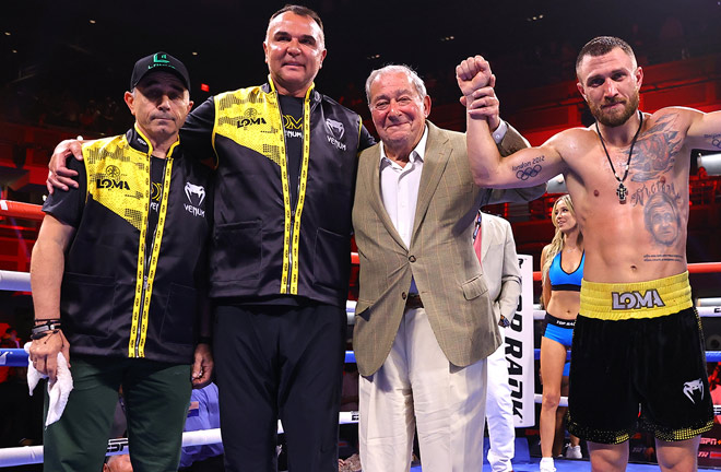 Lomachenko celebrates with his father (far left), manager Egis Klimas (centre left) and promoter Bob Arum (centre right) Photo Credit: Mikey Williams/Top Rank via Getty Images