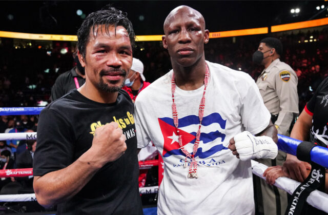 Yordenis Ugas and Manny Pacquiao embraced after their fight in Las Vegas on Saturday night Photo Credit: Sean Michael Ham/TGB Promotions