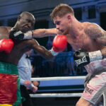 Archie Sharp defended his WBO Global super featherweight title for the first time with a 100-90 points win on all 3 judges scorecards against Alexis Boureima Kabore. Photo Credit: MTK Global.