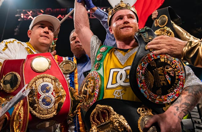 Canelo celebrates after becoming the first man in history to hold all four belt at super middleweight Photo Credit: Ryan Hafey / Premier Boxing Champions