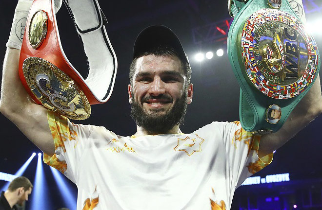 Artur Beterbiev holds the WBC and IBF light heavyweight belts Photo Credit: Mikey Williams/Top Rank