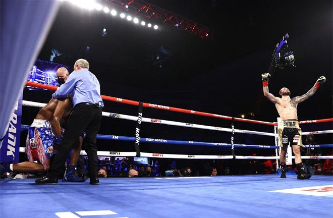 Smith Jr celebrates after stopping Geffrard Photo Credit: Mikey Williams / Top Rank via Getty Images