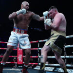 Frazer Clarke took 2 minutes to get his professional record of to a winning start against Jake Darnell. Photo Credit: Boxxer.