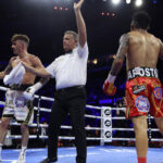 Wood’s trainer Ben Davison threw in the towel to confirm Lara as champion Photo Credit: Mark Robinson/Matchroom Boxing