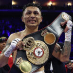 Lara celebrates after securing the WBA strap Photo Credit: Mark Robinson/Matchroom Boxing
