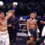 Flores pictured directly behind Paul following his split decision loss to Fury last month Photo Credit: Skill Challenge Entertainment