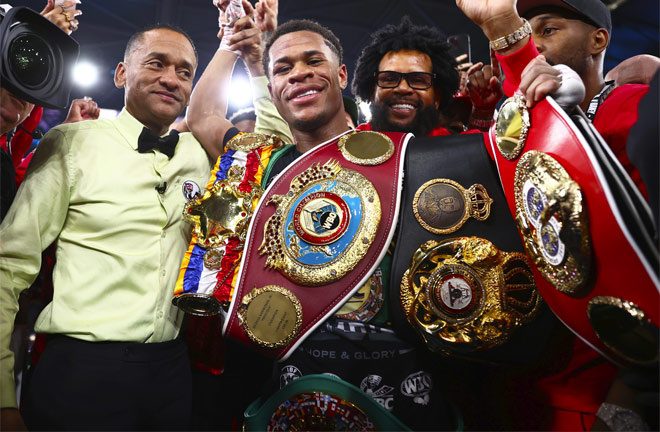 Haney holds the WBC, WBA 'super', WBO and IBF belts Photo Credit: Mikey Williams / Top Rank via Getty Images