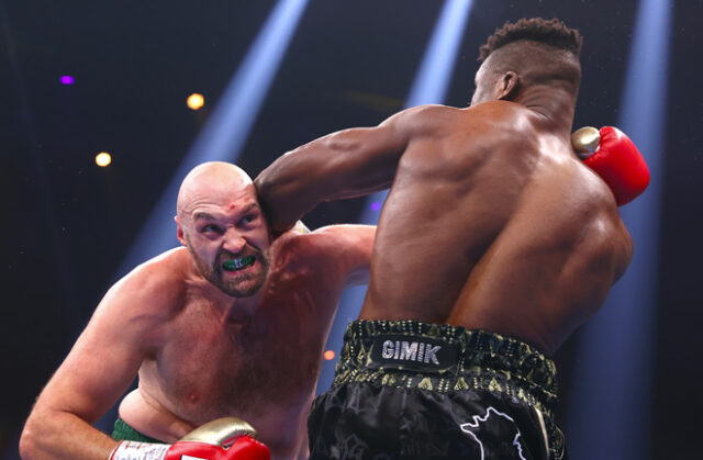 Tyson Fury climbed off the canvas to edge past Francis Ngannou by split decision in Saudi Arabia Photo Credit: Mikey Williams/Top Rank via Getty Images