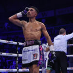 Gill celebrates beating Conlan as referee Howard Foster calls a halt to the contest Photo Credit: Mark Robinson/Matchroom Boxing