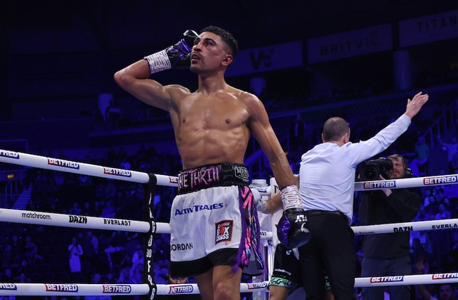 Gill celebrates beating Conlan as referee Howard Foster calls a halt to the contest Photo Credit: Mark Robinson/Matchroom Boxing