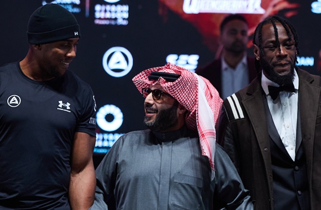 Wilder and Joshua alongside Turki Alalshikh at the first press conference in London Photo Credit: Mark Robinson/Matchroom Boxing