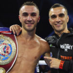 Jason Moloney (L) celebrating his world title victory alongside twin brother Andrew Moloney (R) Photo Credit: Mikey Williams/Top Rank
