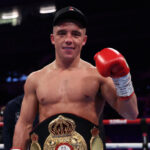 Ball celebrates after retaining his WBA featherweight world title Photo Credit: Leigh Dawney/Queensberry Promotions