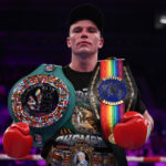 Cain took home three belts after defeating Edwards Photo Credit: Leigh Dawney/Queensberry Promotions