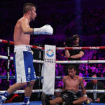 Baluta dropped Strand on route to a split decision victory Photo Credit: Leigh Dawney/Queensberry Promotions