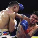 Emanuel Navarrete retained his WBO super featherweight world title with a technical decision win over Charly Suarez in San Diego Photo Credit: Mikey Williams/Top Rank