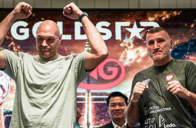 Tyson Fury weighed in over 25 pounds lighter than Mariusz Wach at Thursday's weigh in Photo Credit: Goldstar Promotions Tyson Fury weighed in over 25 pounds lighter than Mariusz Wach at Thursday's weigh in Photo Credit: Goldstar Promotions